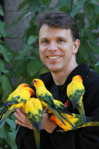 Dr Echols with sun conures